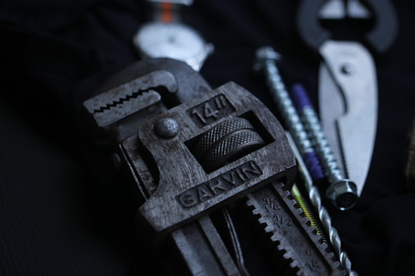 Selective focus on a metal pipe wrench plumbing tool